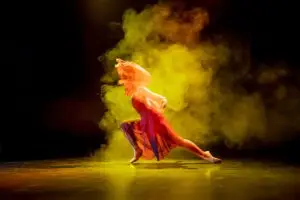 ballet dancer on a stage with dramatic lighting