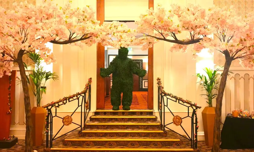 topiary human hedge in the doorway of an event