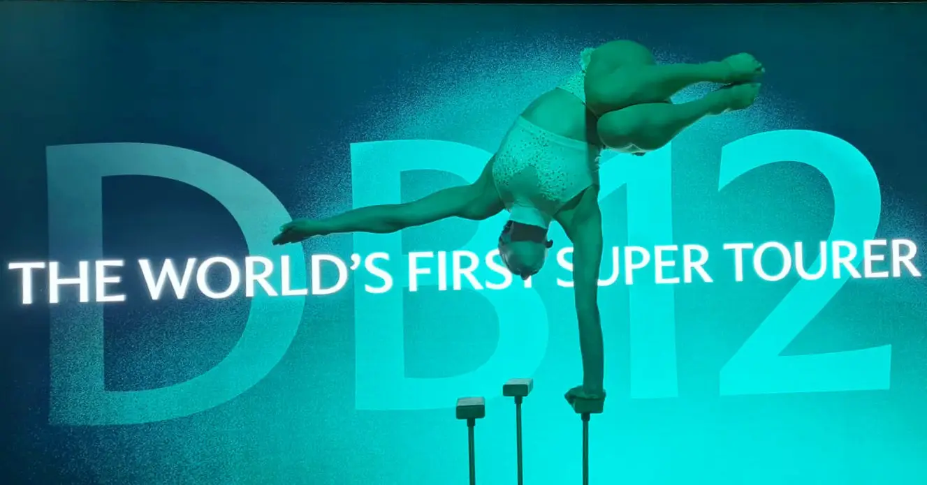 circus acrobat at the Aston martin DB12 launch