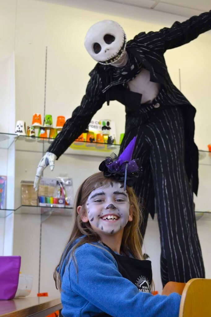 jack skellington stilt walker with a child