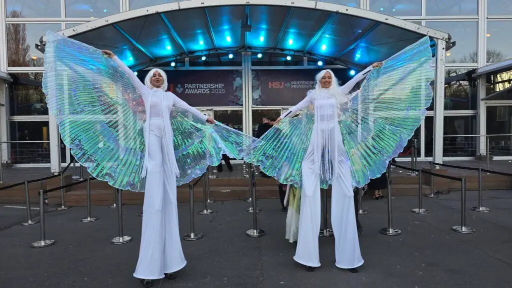 white LED stilt walkers