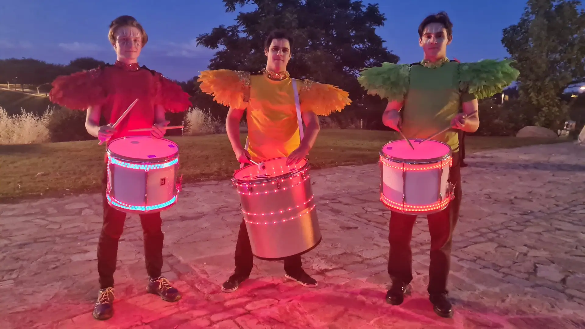 hire carnivla LED drummers in brightly coloured carnival outfits