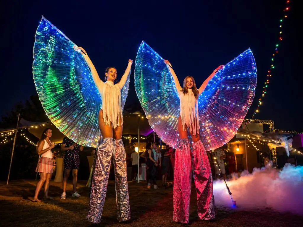 hire LED stilt walkers for a festival. Outdoor stilt walkers
