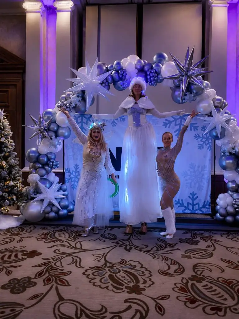 Winter wonderland themed stilt walkers at a christmas party