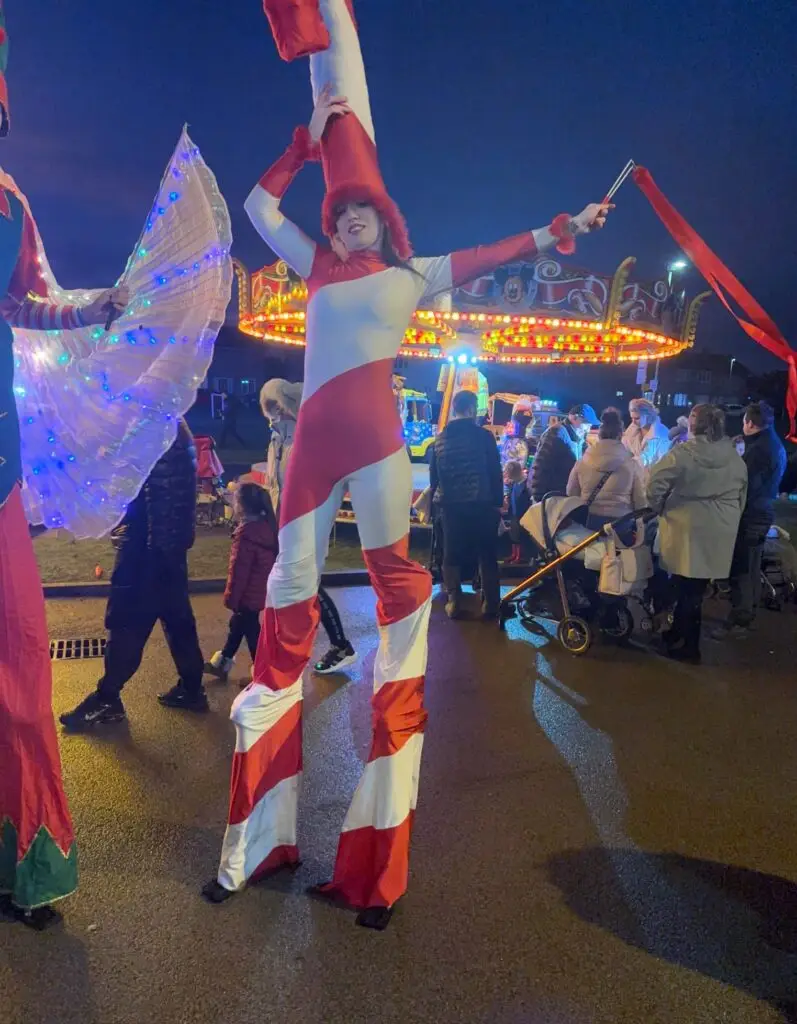 uk christmas parade stilt walkers
