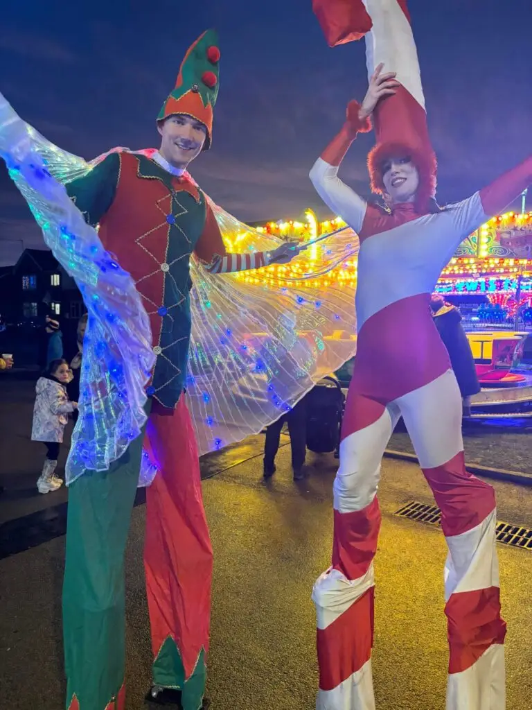christmas candycane and elf stilt walkers