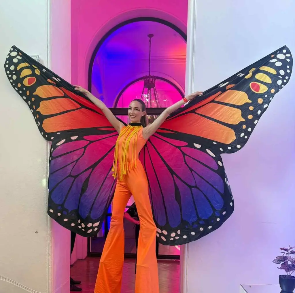 bright butterfly stilt walker with large wings
