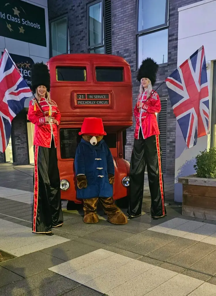 british royal guard stilt walkers with paddington bear