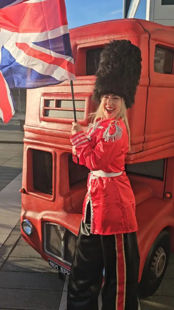 hire a royal guard stilt walker infront of a london bus